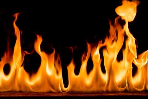 Fire flames on black background. Stock Photos