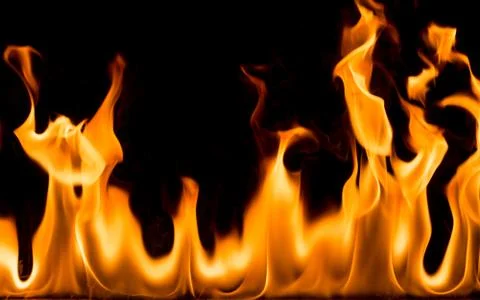 Fire flames on black background. Stock Photos