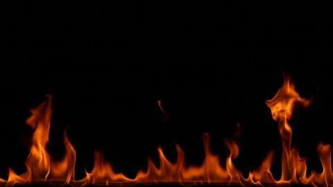 Fire flames on black background. Stock Photos