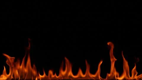 Fire flames on black background. Stock Photos