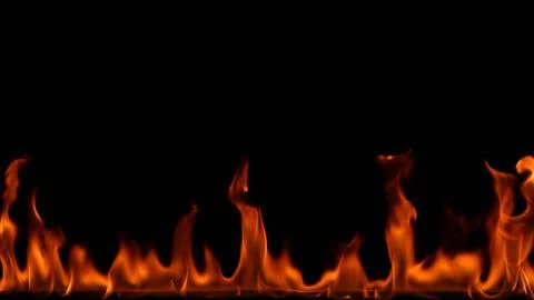 Fire flames on black background. Stock Photos