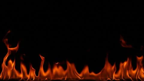 Fire flames on black background. Stock Photos