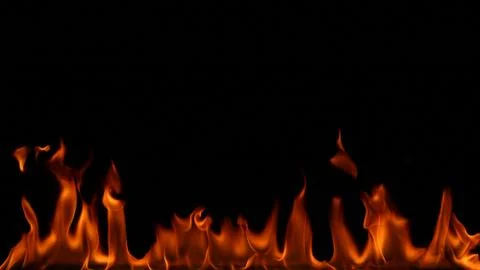 Fire flames on black background. Stock Photos