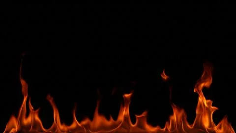 Fire flames on black background. Stock Photos