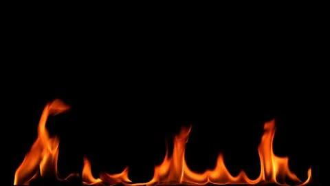 Fire flames on black background. Stock Photos