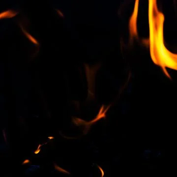 Fire flames on black background Stock Photos