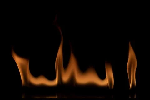 Fire flames on black background. Stock Photos