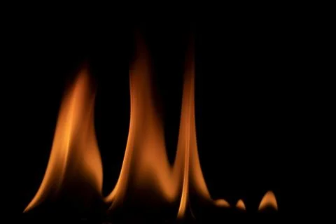 Fire flames on black background. Stock Photos