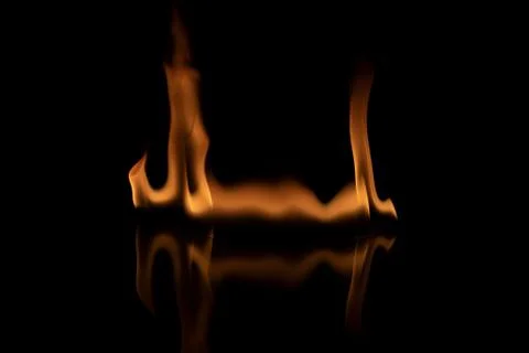 Fire flames on black background. Stock Photos