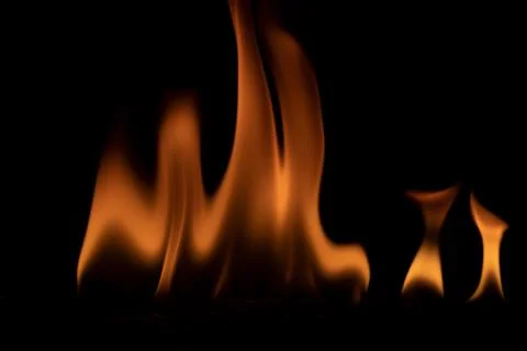 Fire flames on black background. Stock Photos