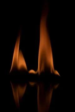 Fire flames on black background. Stock Photos