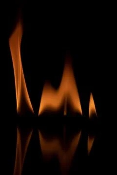 Fire flames on black background. Stock Photos
