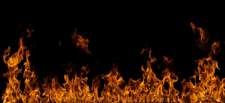 Fire flames on black background. Stock Photos