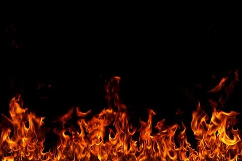 Fire flames on black background. Stock Photos