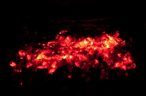 Fire flames on a black background. Red charcoal. Texture bonfire embers. Stock Photos