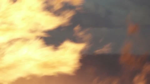 Fire. The flames in blur on the background of the sky. Fire. The fire is burning Stock Footage 148448343