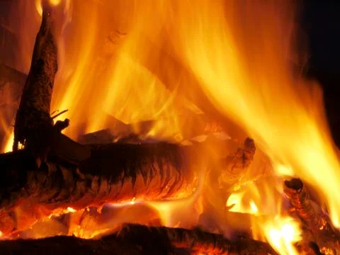 Fire flames of a bonfire on black background Stock Photos