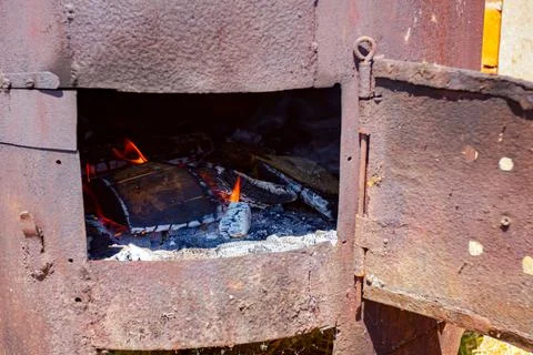Fire flames burns, ablaze in the rusty firebox Stock Photos