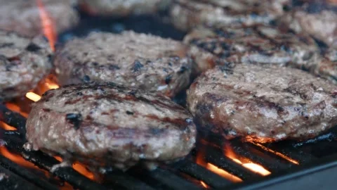 Fire Flames Cooking Beef Burgers on Very... | Stock Video | Pond5