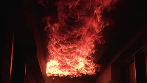 Fire flames crawl along interior house ceiling in dramatic slow motion Stock Footage 232645154