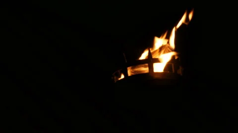 Fire flames in medieval torch on in the dark on black background Stock Footage 122145646
