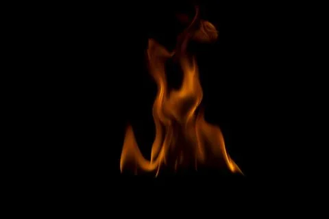 The fire flames is powerful , Shoot in a studio with a black background. Stock Photos