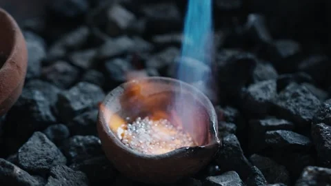 Fire flames in slow motion melt silver for jewelry production Stock Footage 301586900