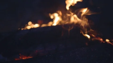 Fire flames with sparks on a black background Stock Footage 77557859