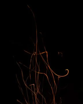 Fire flames with sparks on a black background Stock Illustration