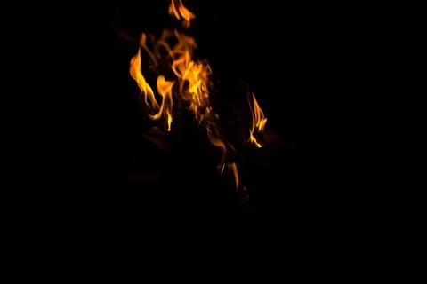 Fire flames with sparks on a black background Foto stock