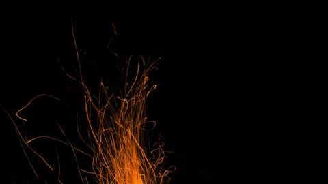 Fire flames with sparks on a black background Stock Photos