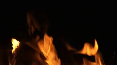 Fire flaring up in dark night Stock Footage 122824300