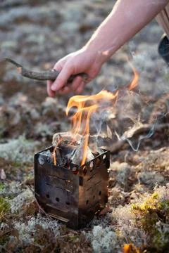 Fire in forest camp. Special small splinter tourist campfire. Stock Photos