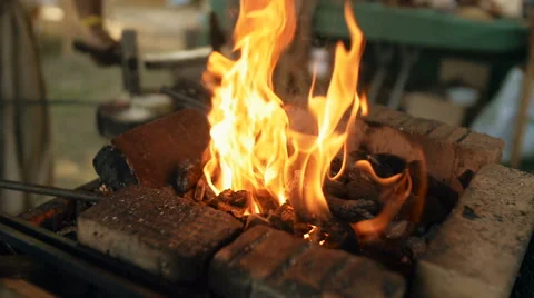 Fire In The Forge. Blacksmith Forges Metal. Slow-mo Video stock 68054420
