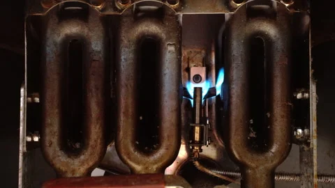 Fire frame Coils Glowing Blue Light At Pilot In Commercial Deep Fryer Machi.. Stock Footage 319705251