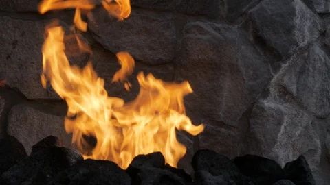 Fire in front of stone wall Stock Footage 102772960