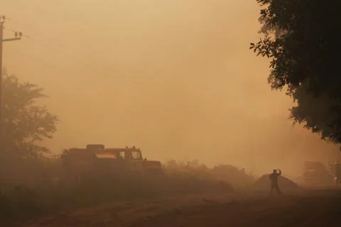 Fire in a garbage dump, smoke and waste Stock Photos