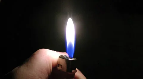Fire from a gas lighter at night Видео 8663336