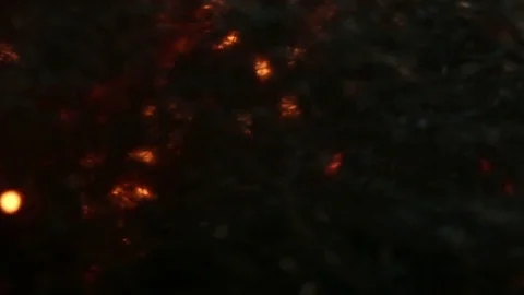 Fire Glows Behind Dark Material MAC Stock Footage 74542974