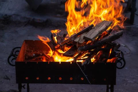 Fire in the grill at night close-up, fire flame Stock Photos