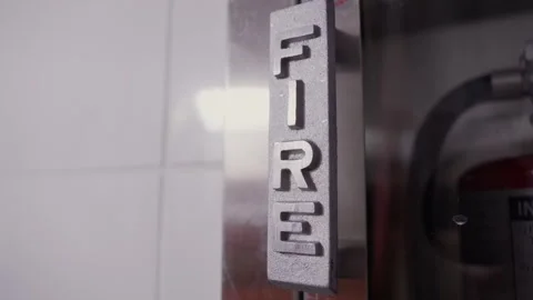 FIRE Handle on Fire Extinguisher Cabinet Stock Footage 313850462