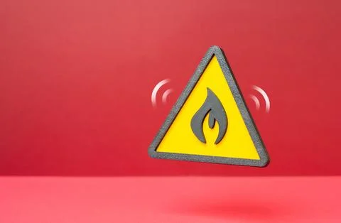 A fire hazard warning symbol. Risk of fire and flammable materials. Concept.. Stock Photos