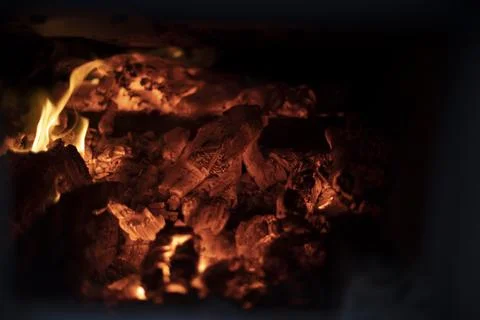 Fire in hearth. Flame texture. Burning coals. High temperature. Stock Photos