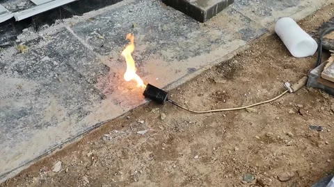Fire heating asphalt - closeup. Stock Footage 145835972
