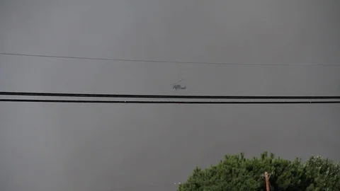 Fire helicopter heads towards emergency Stock Footage 114415880