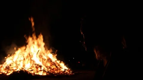 Fire highlights a girl's face Stock Footage 122355650