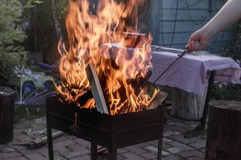 Fire in home grill Stock Photos