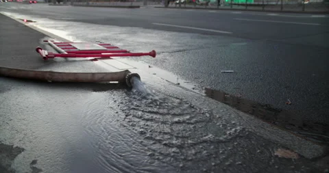 Fire hose on asphalt Stock Footage 318073567