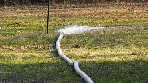 Fire hose pumping water 1 Stock Footage 106418828