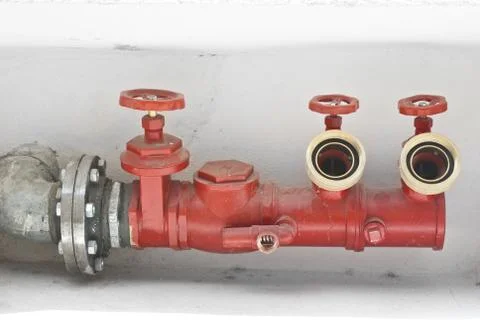 Fire hose on a wall Stock Photos